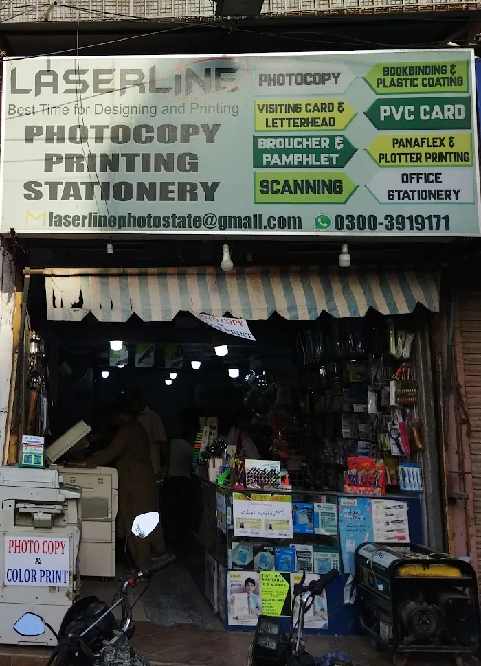 Laserline shop front at Falcon Centre with its green and white services sign